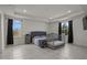 Large bedroom with a crib, two windows, recessed lighting, and neutral-toned walls at 622 Taft Dr, Davenport, FL 33837