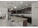 Open kitchen featuring an island with seating, granite countertops, stainless steel appliances, and recessed lighting at 622 Taft Dr, Davenport, FL 33837