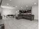 Open-concept living area with a sofa, table, chairs, and seamless flow to the kitchen at 622 Taft Dr, Davenport, FL 33837