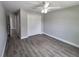Bedroom with ceiling fan, wood-look flooring, and closet at 628 Se Pine Ave, Fort Meade, FL 33841