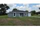 Charming single-story home with a well-maintained lawn and attached garage at 628 Se Pine Ave, Fort Meade, FL 33841
