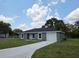 Charming single-story home with a well-maintained lawn and attached garage at 628 Se Pine Ave, Fort Meade, FL 33841