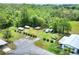 Aerial view showing an over abundance of parking space, with space for camper and boat at 6470 Peppertree Ne Path, Winter Haven, FL 33881