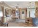 Cozy dining area features built-in cabinetry, neutral tones, and a ceiling fan at 6470 Peppertree Ne Path, Winter Haven, FL 33881