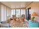 Bright Florida room with tropical decor, comfortable seating, and plenty of natural light at 6470 Peppertree Ne Path, Winter Haven, FL 33881