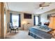 Spacious main bedroom with a ceiling fan and natural light at 6470 Peppertree Ne Path, Winter Haven, FL 33881