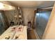 Bathroom featuring updated mirror and vanity and decorative shower at 700 Mirror Nw Ter # 303, Winter Haven, FL 33881
