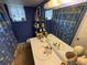 Cozy bathroom with a double sink vanity and decorative shower curtain at 700 Mirror Nw Ter # 303, Winter Haven, FL 33881