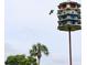Decorative multi-level birdhouse that provides homes for many native birds at 700 Mirror Nw Ter # 303, Winter Haven, FL 33881