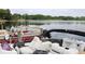 Boat dock with beautiful boats and lake view, perfect for enjoying the outdoors at 700 Mirror Nw Ter # 303, Winter Haven, FL 33881