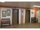 Well-maintained elevator lobby includes seating, artwork, and easy access to upper floors at 700 Mirror Nw Ter # 303, Winter Haven, FL 33881