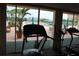 This is the fitness center, which overlooks the pool and waterfront at 700 Mirror Nw Ter # 303, Winter Haven, FL 33881