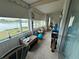Relaxing sunroom with lake view, perfect for enjoying the outdoors indoors at 700 Mirror Nw Ter # 303, Winter Haven, FL 33881