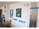 This game room includes a pool cue rack and accessories at 700 Mirror Nw Ter # 303, Winter Haven, FL 33881