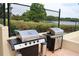 Stainless steel grills with beautiful lake views make this the perfect place to have a cookout at 700 Mirror Nw Ter # 303, Winter Haven, FL 33881