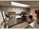 This kitchen features stainless steel appliances, lots of counter space, and lovely decor at 700 Mirror Nw Ter # 303, Winter Haven, FL 33881