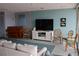 This is a TV lounge with comfortable couches and chairs at 700 Mirror Nw Ter # 303, Winter Haven, FL 33881