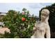 Statue in garden by pool. A serene spot to relax and enjoy the outdoor areas at 700 Mirror Nw Ter # 303, Winter Haven, FL 33881