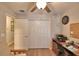A bedroom is equipped with a large closet and wood-look flooring, offering both style and functionality at 710 Persian Dr, Haines City, FL 33844