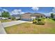 Well-maintained home with a two-car garage, concrete driveway, and neatly landscaped front yard at 710 Persian Dr, Haines City, FL 33844