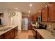 Spacious kitchen featuring stainless steel appliances, granite countertops, and modern cabinetry at 710 Persian Dr, Haines City, FL 33844