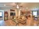 Open living room features wood floors, ceiling fan, view into the kitchen and dining area in an open layout at 710 Persian Dr, Haines City, FL 33844