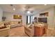 Spacious living room with wood floors, furniture, art and a ceiling fan in an open concept layout at 710 Persian Dr, Haines City, FL 33844