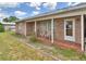 Inviting covered front porch with brick flooring, perfect for relaxing outdoors at 780 Oleander Se Dr, Winter Haven, FL 33880