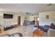 Spacious living room featuring tile flooring, ceiling fan, and open floorplan at 780 Oleander Se Dr, Winter Haven, FL 33880