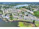 Overhead view of the community, highlighting its proximity to a lake and surrounding neighborhood at 900 Avenue Z Se # B2, Winter Haven, FL 33880