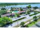 Aerial view of property showing proximity to pool, parking, and surrounding neighborhood near the water at 900 Avenue Z Se # B2, Winter Haven, FL 33880