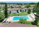 Aerial view of complex featuring a community pool and well-maintained landscaping at 900 Avenue Z Se # B2, Winter Haven, FL 33880