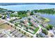 The aerial view showcases a community with a pool, close to a long lake at 900 Avenue Z Se # B2, Winter Haven, FL 33880