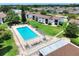 Aerial view of the community pool area and the surrounding apartment buildings at 900 Avenue Z Se # B2, Winter Haven, FL 33880