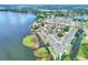 Aerial view of the community with a pool close to a lake at 900 Avenue Z Se # B2, Winter Haven, FL 33880