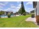 Community backyard features a pool, lawn area, seating, and landscaping at 900 Avenue Z Se # B2, Winter Haven, FL 33880