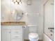 Bathroom with a sink vanity, toilet, and a shower-tub combo with wall mounted towel rack at 900 Avenue Z Se # B2, Winter Haven, FL 33880