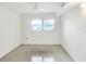 Well-lit bedroom features a ceiling fan and a window providing natural light at 900 Avenue Z Se # B2, Winter Haven, FL 33880