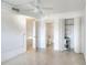Bedroom with a ceiling fan, closet, and an open doorway to a bathroom at 900 Avenue Z Se # B2, Winter Haven, FL 33880