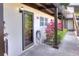 Exterior view of the home featuring the front door, beige walls, and dark brown accents at 900 Avenue Z Se # B2, Winter Haven, FL 33880