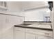 Bright kitchen with a double basin sink, dishwasher, and tile backsplash at 900 Avenue Z Se # B2, Winter Haven, FL 33880