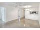 A bright and airy living space with tile flooring, a modern ceiling fan, and a kitchenette at 900 Avenue Z Se # B2, Winter Haven, FL 33880