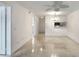Bright and airy living space with tile flooring, modern ceiling fan, and open layout at 900 Avenue Z Se # B2, Winter Haven, FL 33880