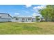 Landscaped backyard includes a patio area for outdoor dining and relaxing, with backyard views at 900 Lake Jessie Dr, Winter Haven, FL 33881