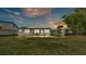 Spacious backyard featuring a patio area perfect for outdoor gatherings and entertaining at 900 Lake Jessie Dr, Winter Haven, FL 33881