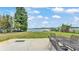 Lush backyard featuring a patio, lake, and dock with gazebo at 900 Lake Jessie Dr, Winter Haven, FL 33881
