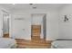 Bright bedroom with hardwood floors, ceiling fan, and large closet for ample storage space at 900 Lake Jessie Dr, Winter Haven, FL 33881