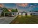 Charming single story home boasts mature landscaping, carport, and is freshly painted at 900 Lake Jessie Dr, Winter Haven, FL 33881