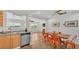Open-concept kitchen with views of the water and stainless steel appliances at 900 Lake Jessie Dr, Winter Haven, FL 33881