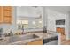Kitchen area with a sink and view to the outside through a window at 900 Lake Jessie Dr, Winter Haven, FL 33881
